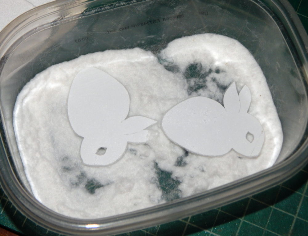 Cut outs in flocking powder