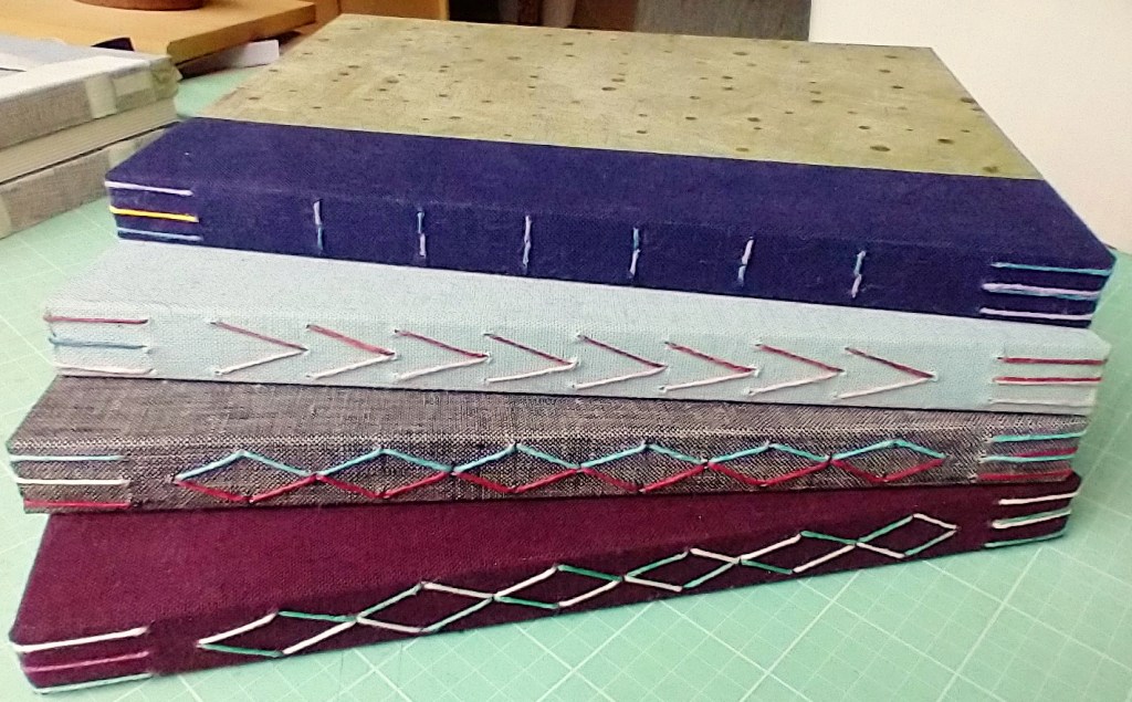 Sketchbooks stacked up