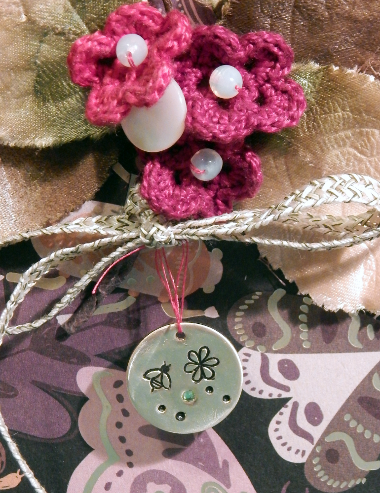 Detail of flowers and metal charm