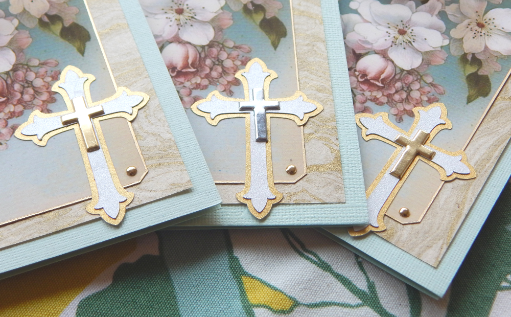 Cross brads on cut out two layer paper crosses.