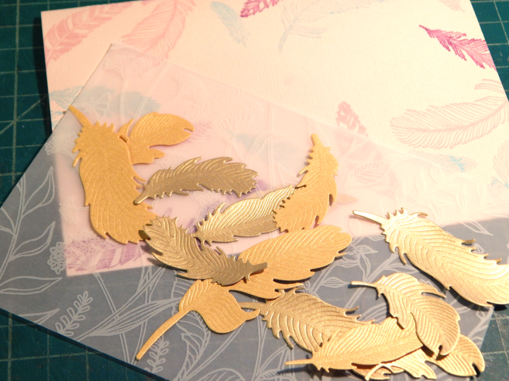 Time to fly card elements, feather, printed velum and stamped card.